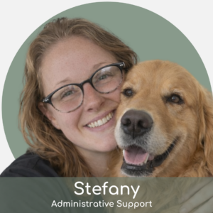 Stef (1) A smiling person with glasses hugs a happy golden retriever. The background is a muted green circle. Text at the bottom reads: "Stefany, Administrative Support.